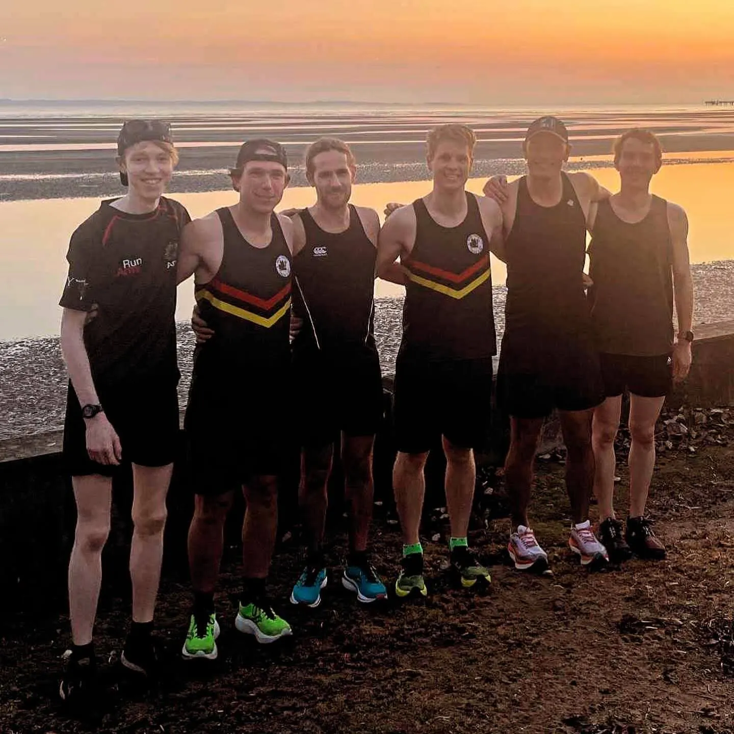 Black Team, captained by Aidan Dineen, at sunrise by the water