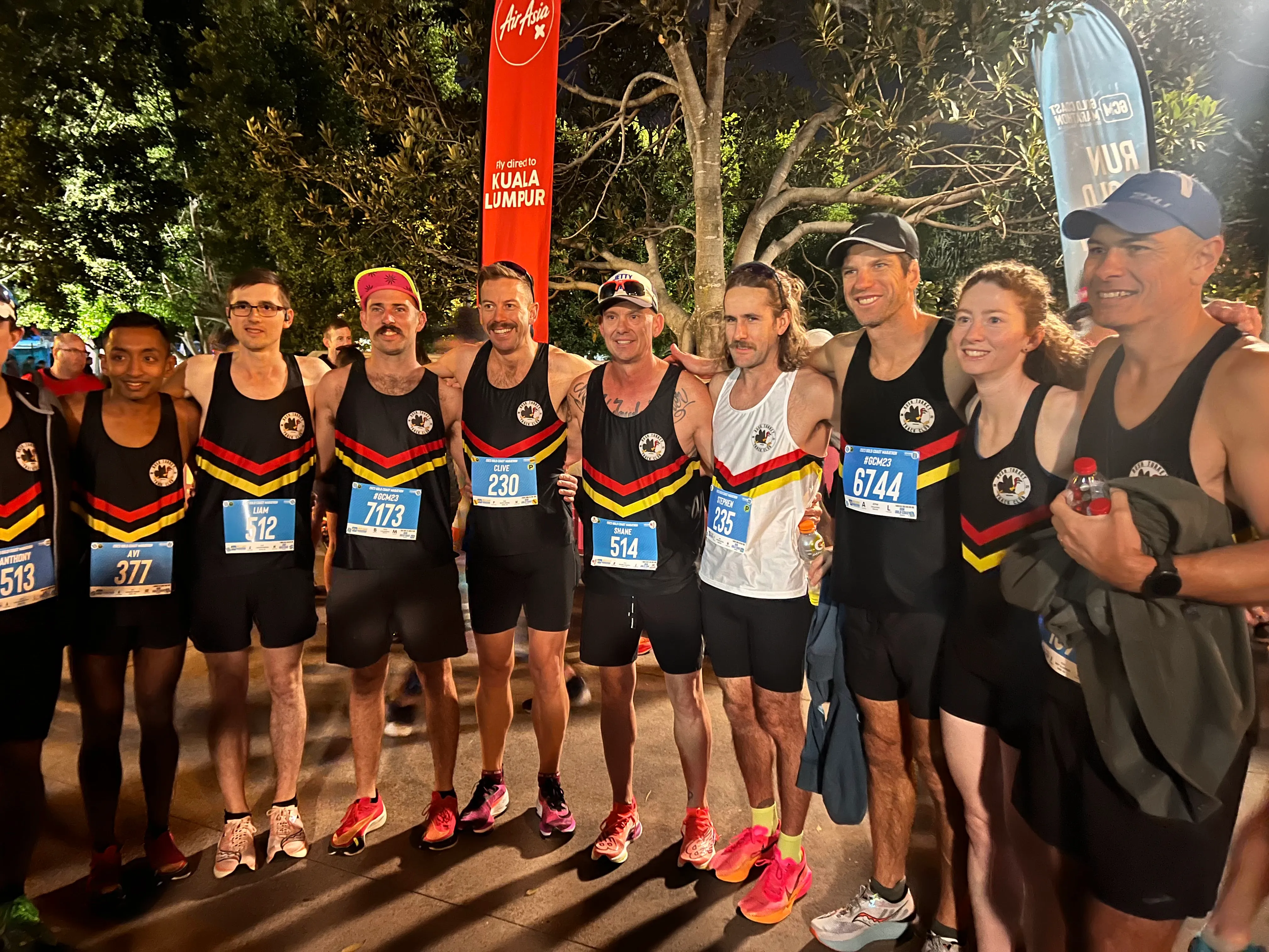 Club members in Bush Turkey singlets and race bibs together before the Gold Coast Marathon