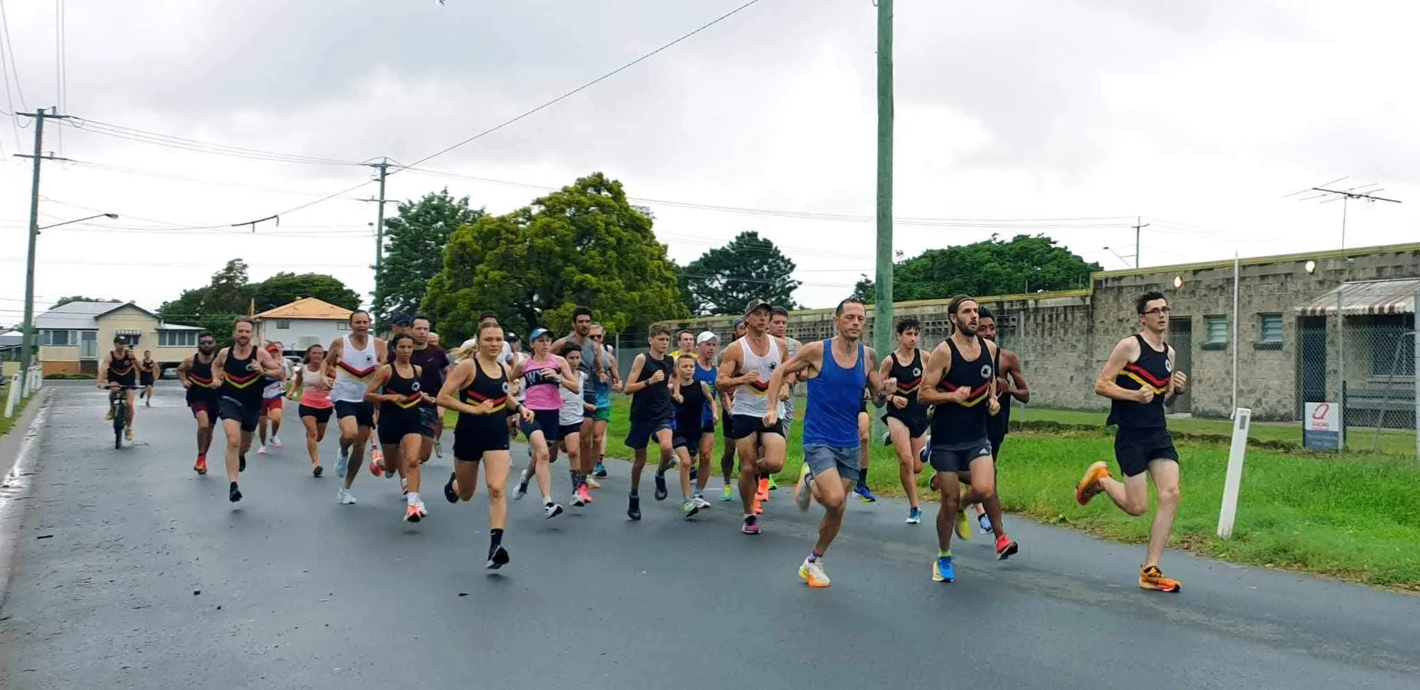 Runners racing down Racecourse Road in Bush Turkey Classic Round Three